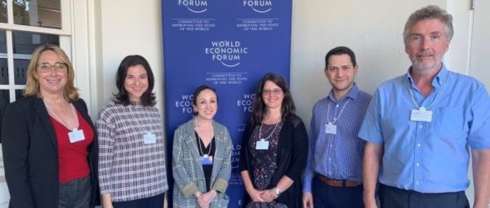With co-authors at a World Economic Forum meeting.